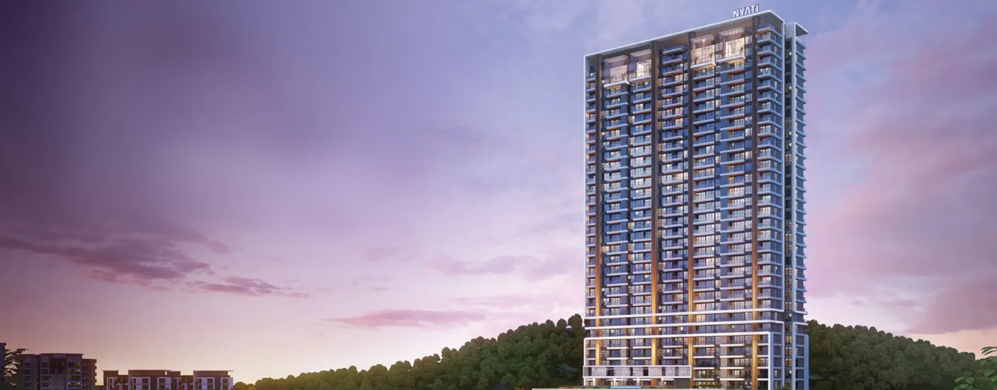 Nyati Elenor tower at dusk amid greenery